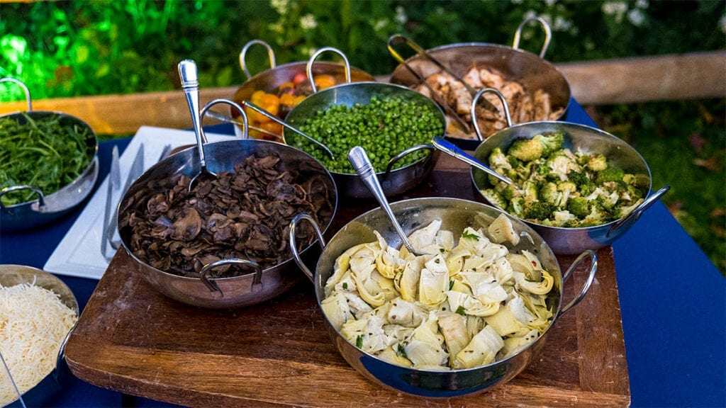 Vegetables in silver serving bowls for outside catering