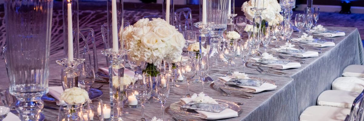 close up image of a table set for a wedding and floral centerpieces