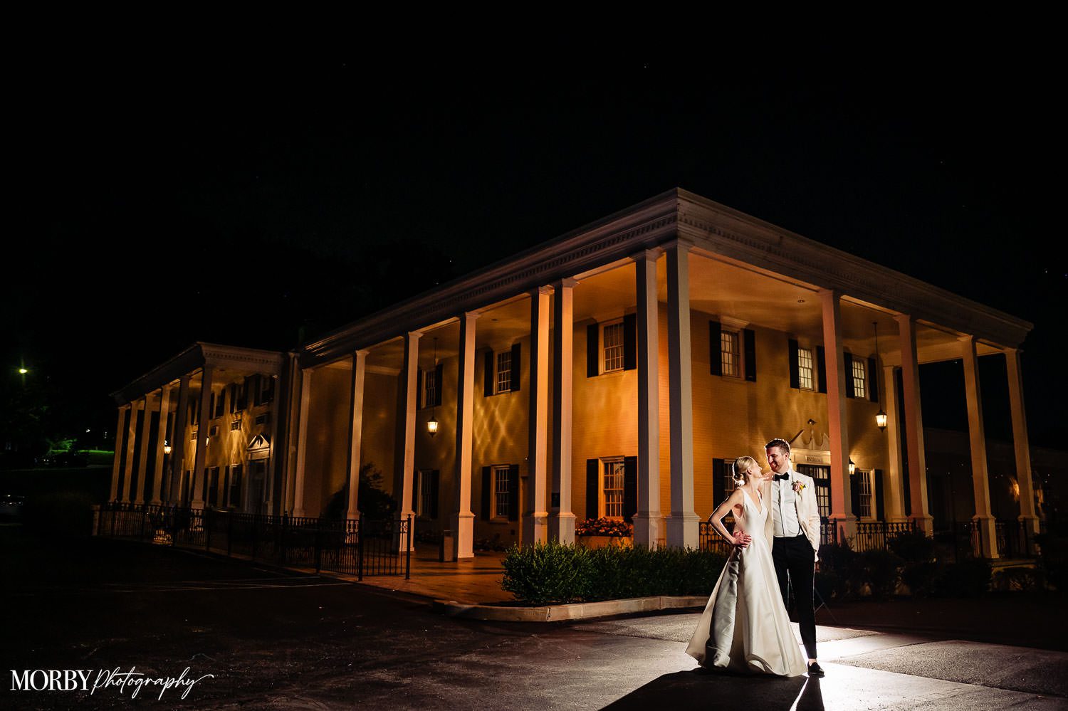 Bride and Groom standing outside of the Drexelbrook